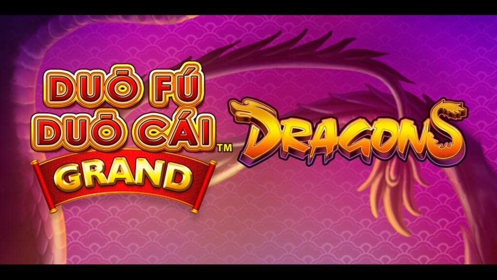 The Duo Fu Duo Cai Grand Dragons slot title. The background is a rich piece of fabric with an ornate design and light pink, lavender, and purple hues. The tail of a dragon sculpture is in front of the fabric. In the foreground is the game title. The words Duo Fu Duo Cai are in a red font with a golden outline. The word “Grand” is against a red scroll in gold. The word “Dragons” is in a fantasy-style gold and orange font.