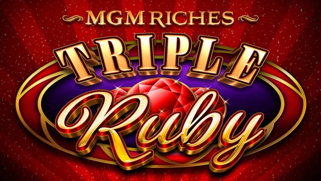 The MGM Riches Triple Ruby title screen. The backdrop features beams of dark and light red with scattered ticker tape. In the foreground is the game logo with the text “MGM Riches Triple Ruby” in three different, gold fonts. The text is set in front of a circular shape with three red gems inside.