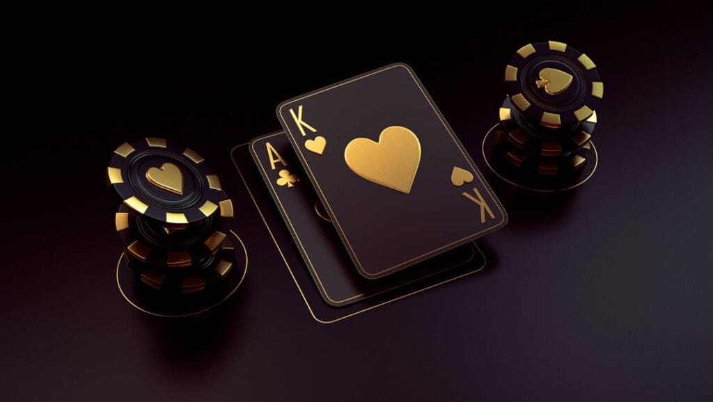 A black and gold ace and king next to two stacks of black and gold casino chips.
